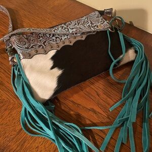 Myra Bag Cowhide Clutch with Teal Fringe